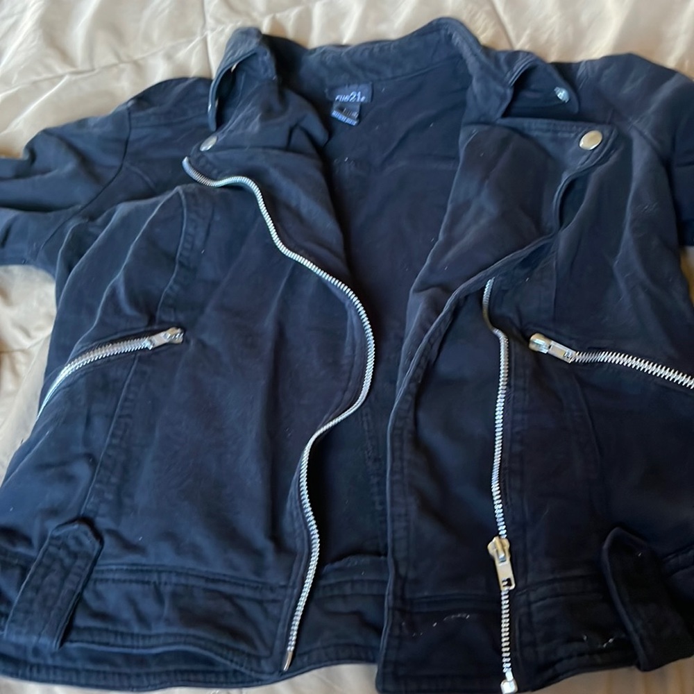 Black jacket with silver zippers
